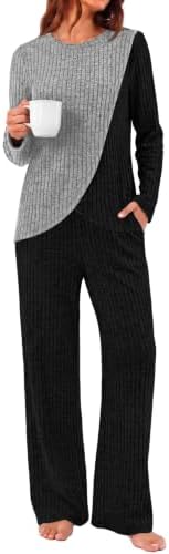 A relaxed two-piece set in grey and black with a curved hem top and wide-leg lounge pants for travel days.