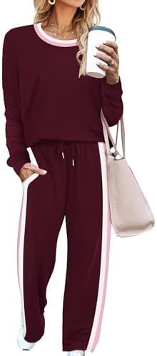 Deep wine red knit pairs with athletic side stripes on this relaxed two-piece set, cut with long sleeves and wide legs.