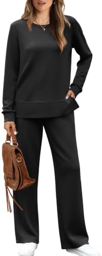 A solid black crewneck top with side slits pairs with wide-leg pants for a clean, unified profile from morning to evening.