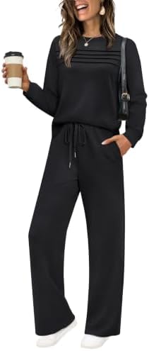 Deep black fabric brings a clean finish to this two-piece set, combining a pleated crewneck top with wide-leg drawstring pants.