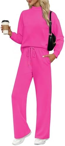 A breezy spacer knit shapes this hot pink two-piece set, pairing a mock neck top with wide-leg drawstring pants.