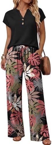 Tropical pink foliage against a deep black ground gives this breezy two-piece set an instant vacation feel.