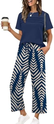 A breezy navy print two-piece set cut from silky spacer knit, featuring cropped wide-leg pants and a side-slit top.