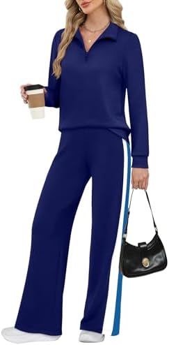 Cut from drapey four-way stretch spacer fabric, this navy blue set pairs a half-zip pullover with relaxed wide-leg sweatpants.