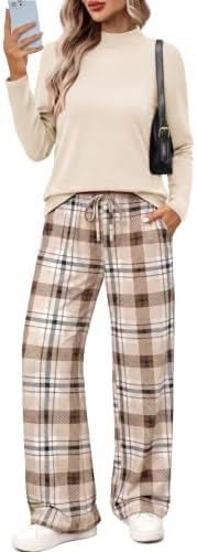 Spun from a soft stretch knit, this checkered two-piece set pairs a mock neck top with roomy wide-leg pants.