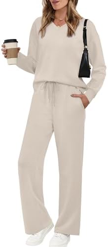 Soft beige knit shapes this two-piece set, combining a relaxed V-neck pullover with wide leg pants for easy travel days.