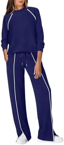 Deep navy matching set with crisp piping lines, a mock neck collar, and four-way stretch fabric for long travel days.