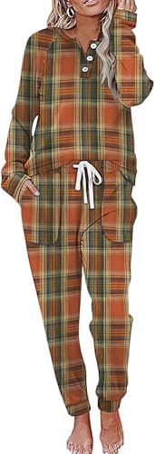 Warm orange and brown plaid covers this two-piece fleece set, featuring a henley button top and matching drawstring jogger pants.