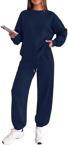 Spun from a soft cotton-poly knit, this deep navy matching set pairs an oversized crewneck with neat tapered joggers.