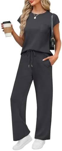 A soft cap-sleeve top and wide-leg pants cut from lightweight spacer knit in dark grey for breezy travel days.
