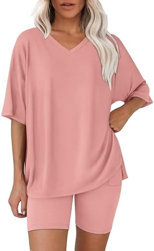 A soft pink two-piece set pairing an oversized short-sleeve tee with flexible biker shorts for easy warm-weather dressing.