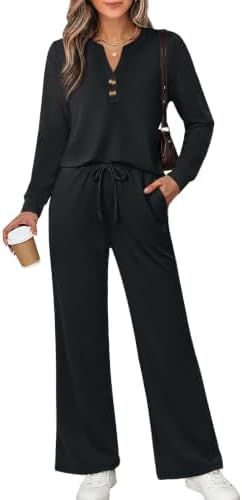 A deep black two-piece set cut from silky spacer fabric, pairing a notched V-neck top with easy wide-leg pants.