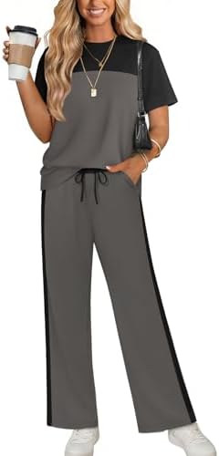 A charcoal dark gray two-piece lounge set with crisp side stripes on breezy, wide-leg knit pants.