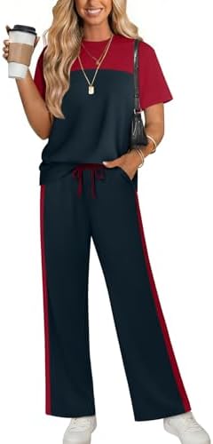 Deep navy knit pairs with crisp side striping across this two-piece set, cut wide through the leg for travel and lounging.