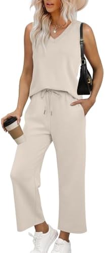 Soft beige knit shapes this two-piece set, combining a breezy sleeveless V-neck with airy wide-leg cropped pants for warm days.