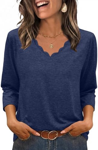 A softly scalloped neckline and three-quarter sleeves define this lightweight top, dyed in a rich, dependable navy blue shade.