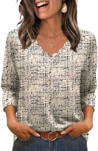 A crisp black dot print sets off this lightweight knit blouse, cut with three-quarter sleeves and a neat curved hem.