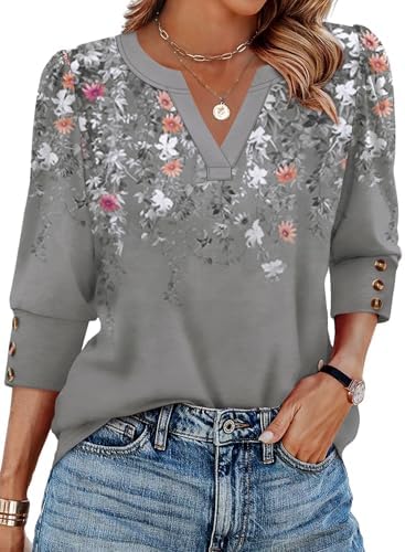 Muted grey floral print pairs subtle puff shoulders with triple-button cuffs on a soft, lightweight three-quarter sleeve top.
