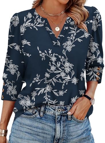 Puffed shoulders and tailored triple-button cuffs sharpen this lightweight navy print top with three-quarter sleeves.