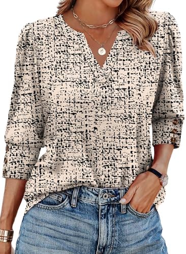Subtle puff shoulders and three-button cuffs frame this three-quarter sleeve blouse in contrasting beige and black.