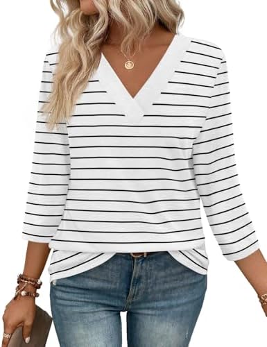Crisp horizontal stripes in clean white and black bring a fresh look to this relaxed three-quarter sleeve knit tunic.
