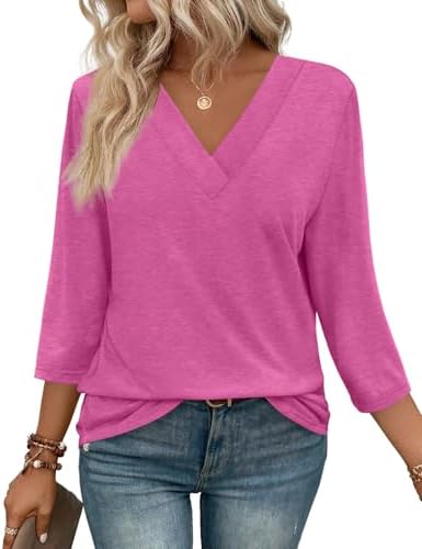 A vivid hot pink knit cut with three-quarter sleeves and an open V-neckline gives this loose tunic plenty of sunny energy.