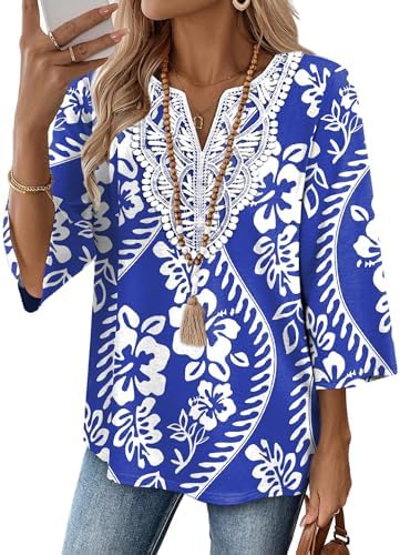 Crisp blue tribal patterns mix with white floral motifs across this soft three-quarter sleeve tunic top.