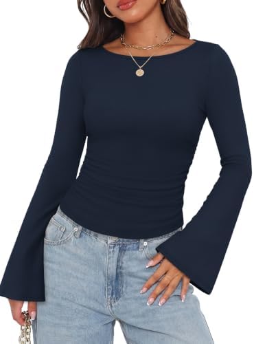 Flared bell cuffs and subtle side ruching shape this deep navy boat neck top in a soft, stretchy ribbed knit.