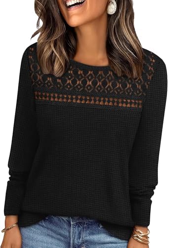 Crochet lace paneling above the chest brings rich texture to a solid black knit with easy long sleeves.