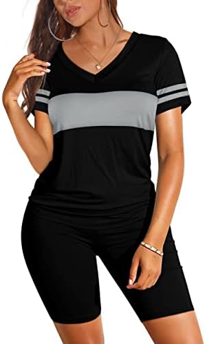 A solid black short set cut from flexible stretch knit, pairing a relaxed V-neck tee with high waist biker shorts.