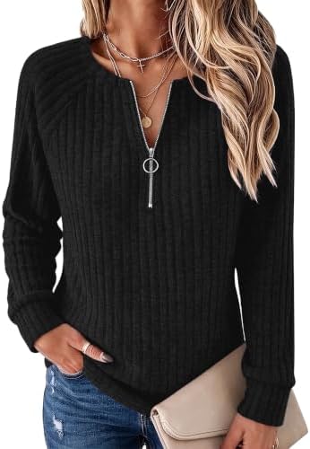 A ribbed quarter-zip pullover in black with a neat ring pull, cut loose through the body for cool-weather layering.