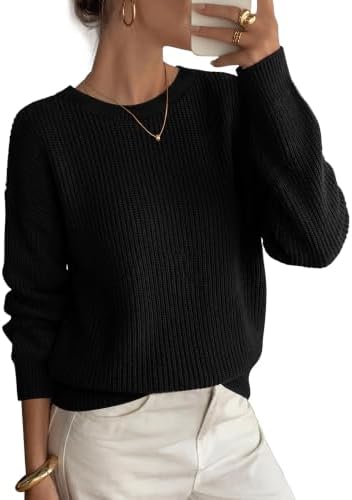 Chunky ribbed knit brings cozy texture to this solid black pullover, cut with dropped shoulders for easy layering.