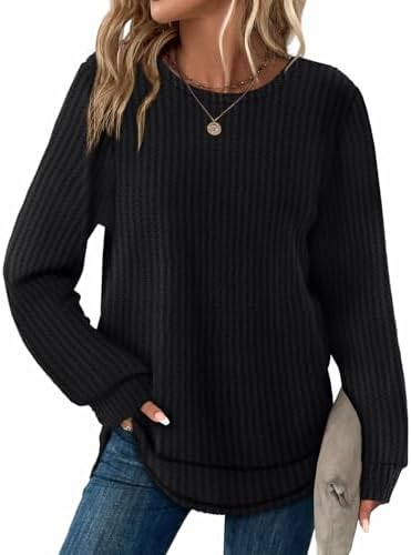 Woven with a textured waffle grid, this black long sleeve tunic drops into a gentle curved hem that pairs easily with leggings.