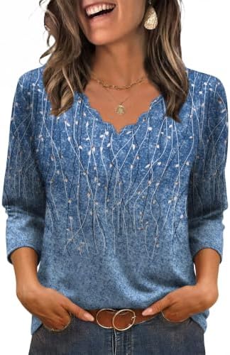 A soft light blue knit cut with three-quarter sleeves and a gentle curved hem that stays put when tucked.