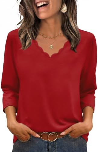 A vivid red knit top with gentle scalloped edges and three-quarter sleeves that fall just past the elbow.