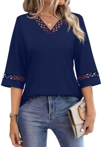Lace trim along a three-quarter sleeve gives this navy blue tunic top a clean finish for the office.