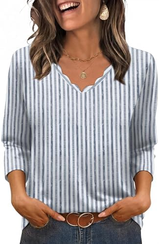 Crisp blue stripes meet a scalloped V-neck on this easy three-quarter sleeve top, cut with a curved hem that sits cleanly over denim.