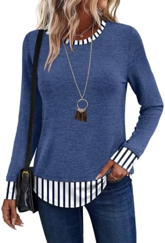 Deep navy knit meets a clean striped lower panel for an easy evening layer that feels soft against bare skin.