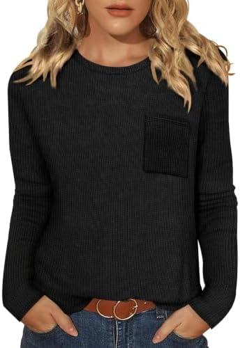 A thin waffle knit top in true black with a classic crewneck, long sleeves, and a curved hem.