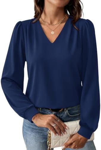 Deep navy polyester blend fabric with gentle stretch shapes this long sleeve blouse, finished with subtle pleats and a classic V-neck.