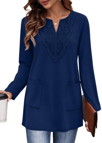 Deep navy blue meets delicate lace trim on this soft long sleeve tunic cut with two side pockets and a relaxed hip length.