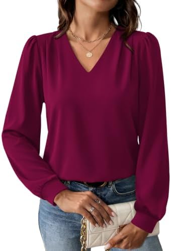 Delicate shoulder pleats meet a rich purple red hue in a stretchy knit that drapes cleanly through a busy workday.