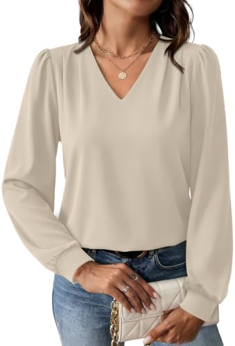 A soft beige knit blouse cut with subtle shoulder pleats and gathered long sleeves for a neat weekday look.