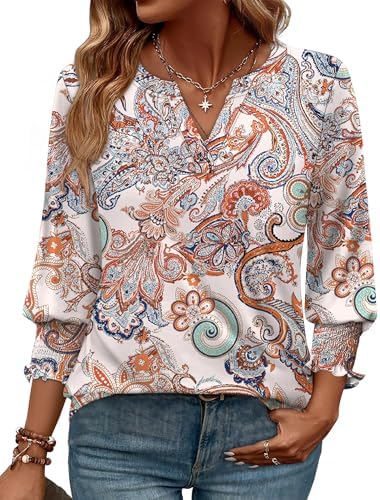 Intricate ethnic patterns cover this lightweight three-quarter sleeve top, cut with a relaxed V-neckline and curved hem.