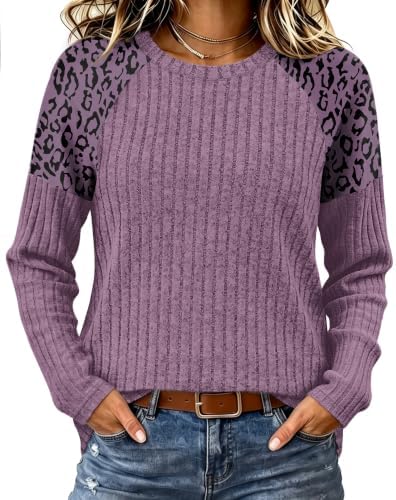 Tonal leopard raglan sleeves set this rich purple knit tunic apart, finished with a classic crew neck and a relaxed drape.