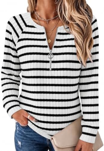 Fine horizontal stripes on black ground give this quarter-zip ribbed knit top a clean line for desk days and cool evenings.