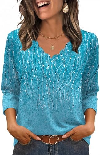 A crisp blue leaf print covers this lightweight blouse, tailored with a curved scalloped neck and breezy three-quarter sleeves.