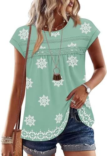 A soft floral green print pairs with delicate lace crochet and a loose peplum hem for warm sunny afternoons.