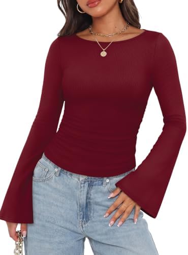 A deep wine red ribbed knit shapes this slim long sleeve top, finished with sweeping bell sleeves and gentle side ruching.