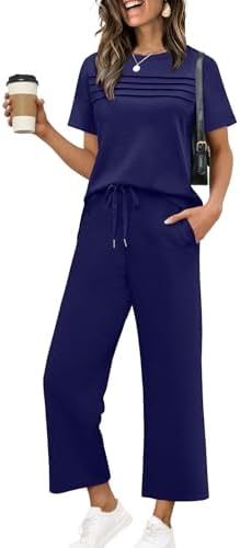 Cut in deep dark blue spacer knit, this two-piece pairing matches a pleated short-sleeve top with cropped wide-leg pants.